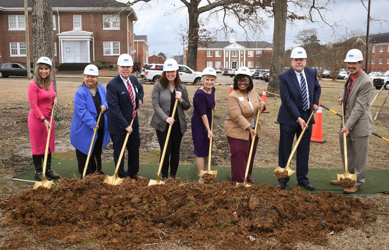 Dr. Kathy Murphy, president of Gadsden State, breaks ground with members of the executive cabinet.